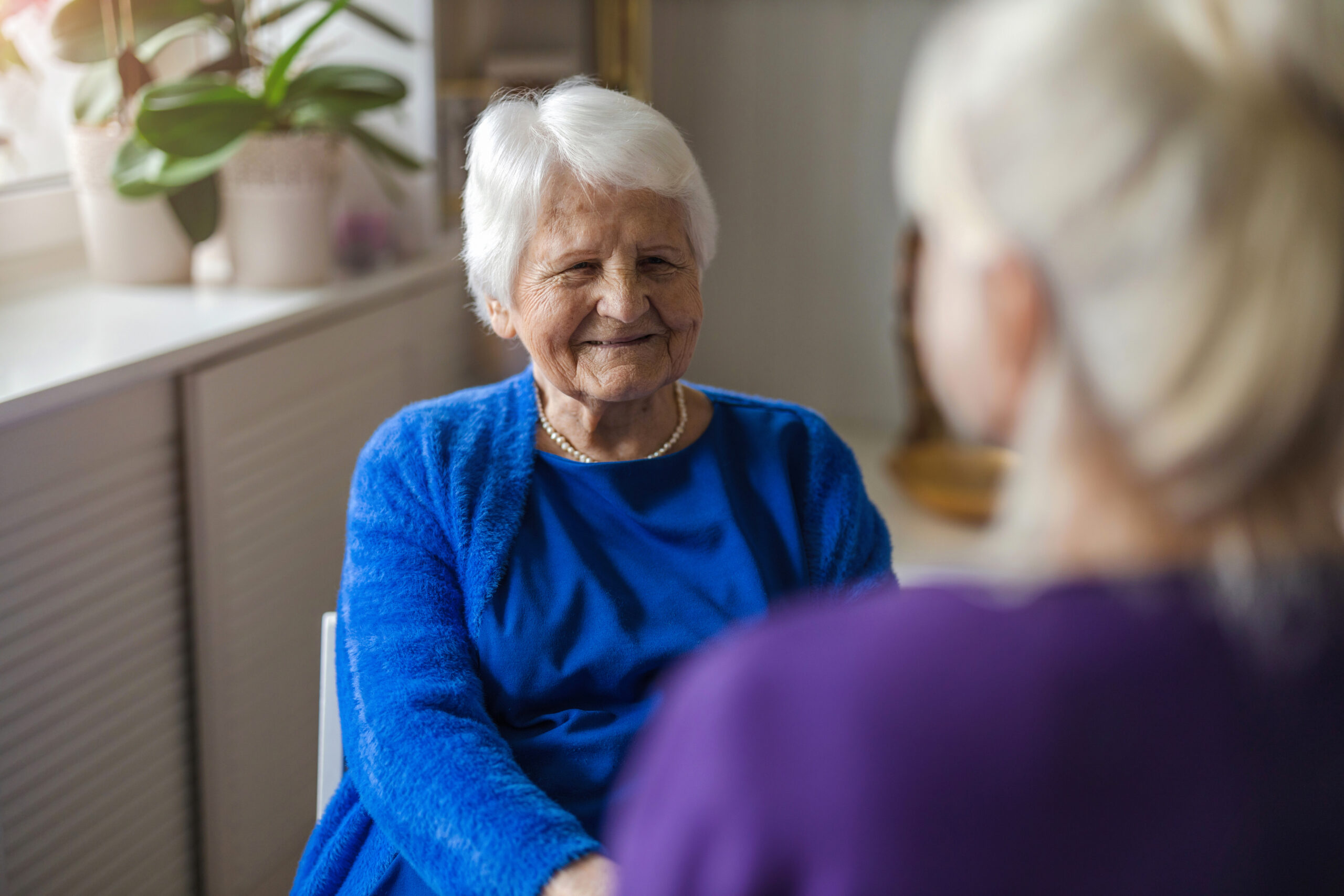 Elderly woman with nurse care giver
